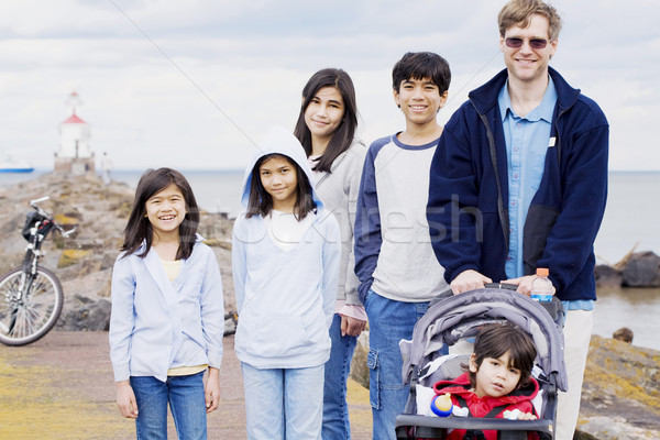 Father with his five children at beach Stock photo © jarenwicklund