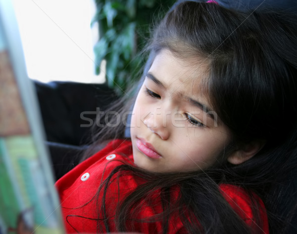 Child sadly reading a story Stock photo © jarenwicklund