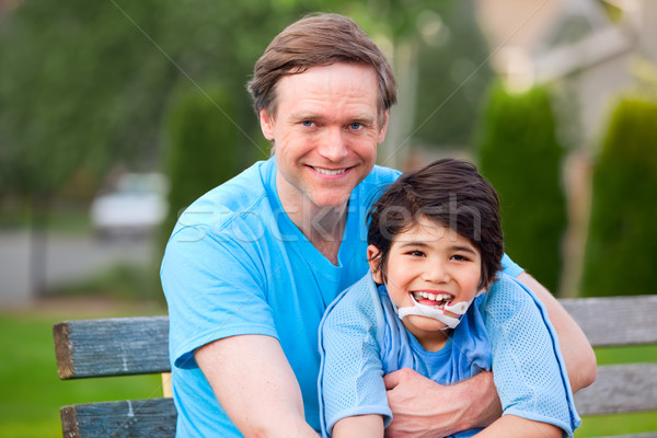 Przystojny ojciec uśmiechnięty niepełnosprawnych syn Zdjęcia stock © jarenwicklund