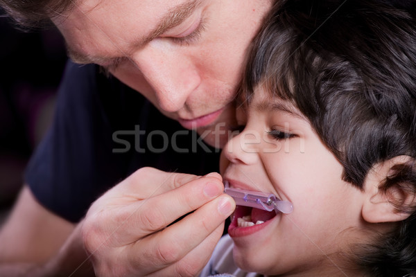 Father helping his disabled son Stock photo © jarenwicklund