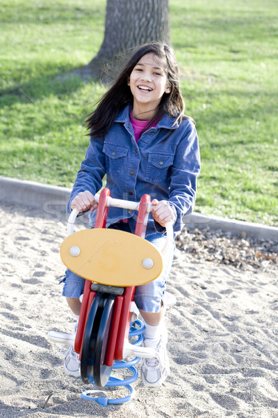 Fille jouer aire de jeux cheval à bascule sable amusement [[stock_photo]] © jarenwicklund