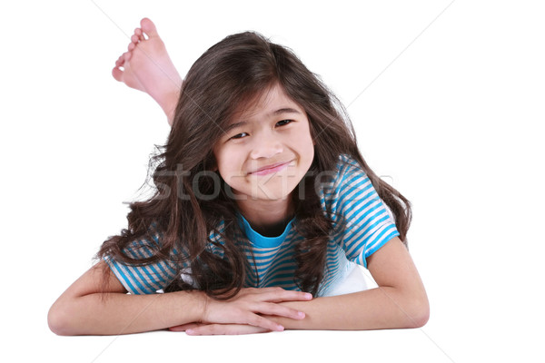 Hét éves lány fekszik padló mosolyog kamera Stock fotó © jarenwicklund