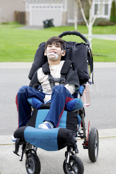 Happy little disabled boy in wheelchair Stock photo © jarenwicklund