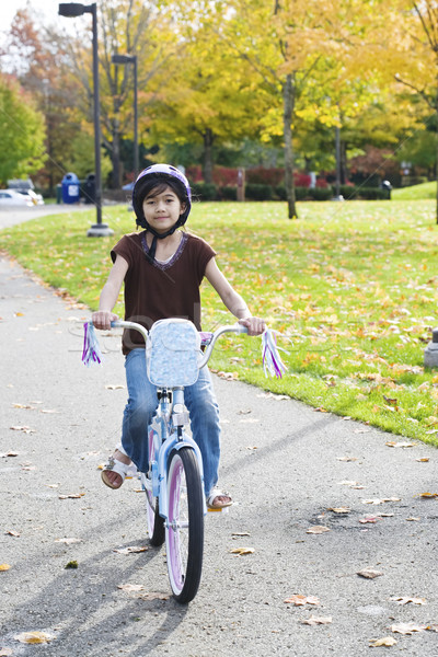 Little girl riding bike in park Stock photo © jarenwicklund