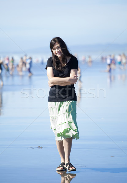 Beautiful biracial young woman or teen walking along beach by Pa Stock photo © jarenwicklund