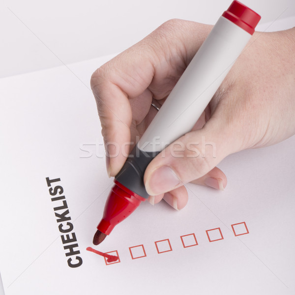 Checklist on white with marker and woman hand Stock photo © jarin13