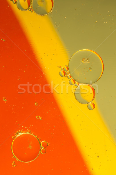 Oil drops on a water surface Stock photo © jarin13