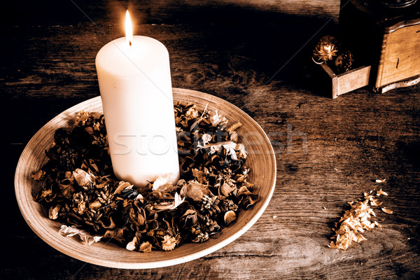 Candle on the wooden plate with coffee mill Stock photo © jarin13