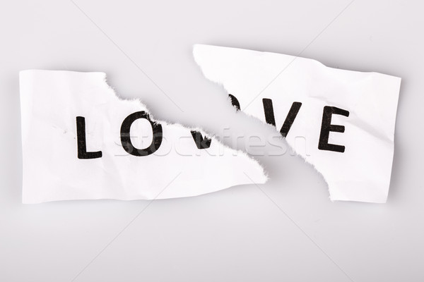 'Love' word written on torn paper Stock photo © jarin13