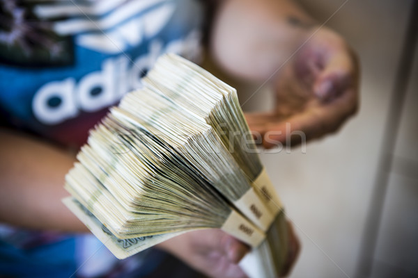 Stock photo: pack of money - big pile of banknotes in hand