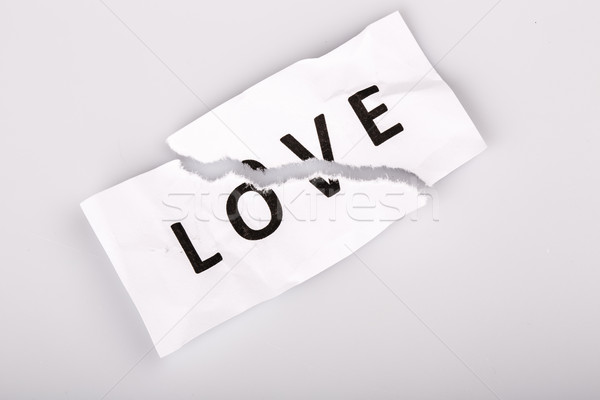 'Love' word written on torn paper Stock photo © jarin13