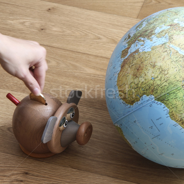 Money box with globe of world Stock photo © jarin13