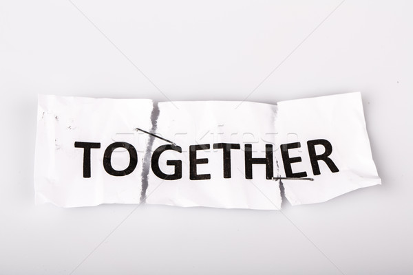 'TOGETHER' words written on torn and stapled paper Stock photo © jarin13