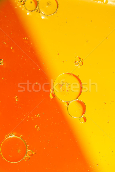 Oil drops on a water surface Stock photo © jarin13