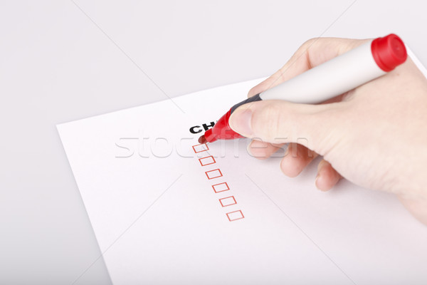 Checklist on white with marker and woman hand Stock photo © jarin13