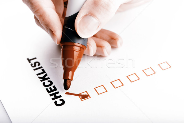 Checklist on white with marker and woman hand Stock photo © jarin13