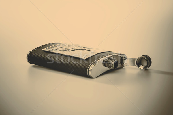 Stock photo: Stainless hip flask isolated on white background