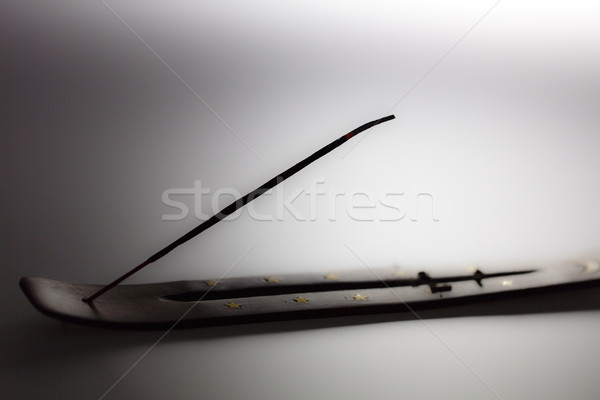 Incense stick on a wooden support on a white background Stock photo © jarin13