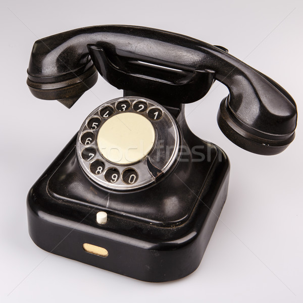 Oude zwarte telefoon stof witte geïsoleerd Stockfoto © jarin13