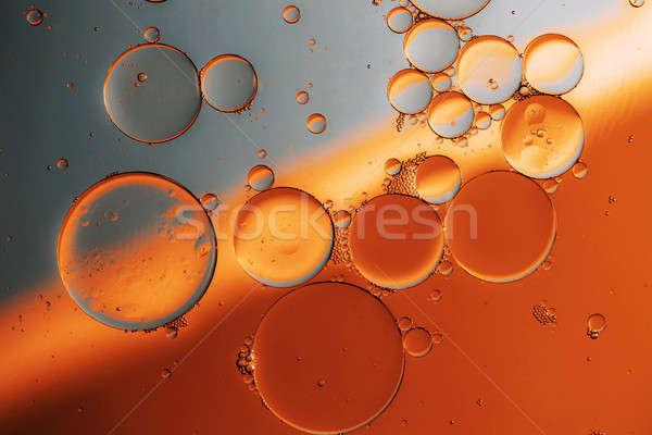 Öl Tropfen Wasseroberfläche Farbe Hintergrund Regenbogen Stock foto © jarin13