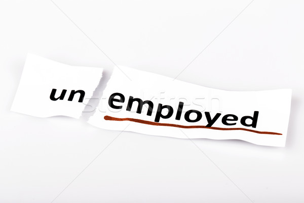 The word unemployed changed to employed on torn paper Stock photo © jarin13