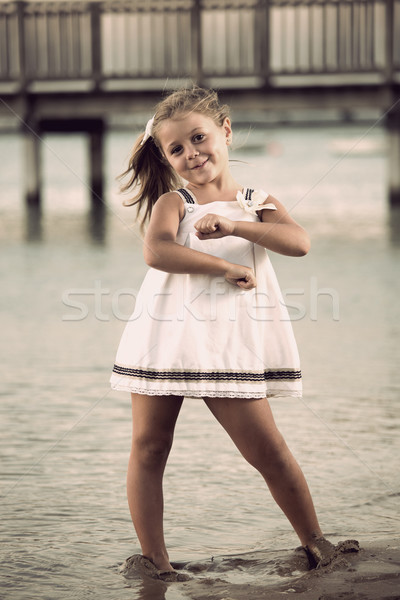 Vintage dançar beautiful girl posando praia pôr do sol Foto stock © jarp17