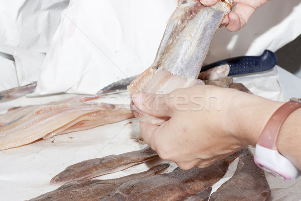 fishmonger cleaning fish Stock photo © jarp17