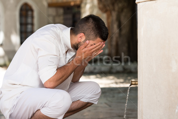 Islamic Religious Rite Ceremony Of Ablution Face Washing Stock photo © Jasminko