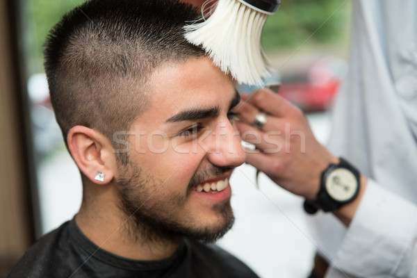 Hairdresser Cleaning Young Man After Haircut Stock photo © Jasminko