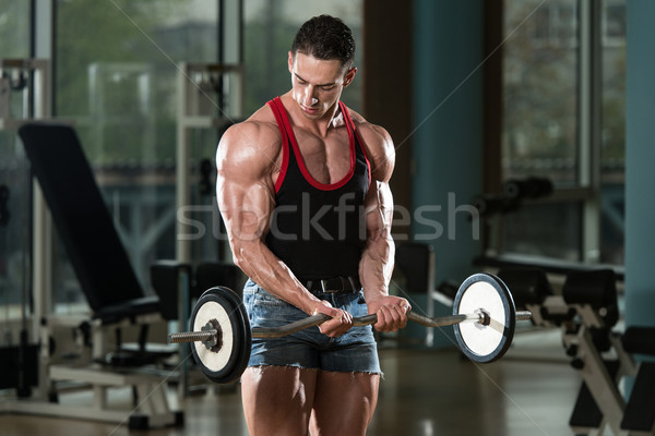 Muscular Man Exercising Biceps Stock photo © Jasminko