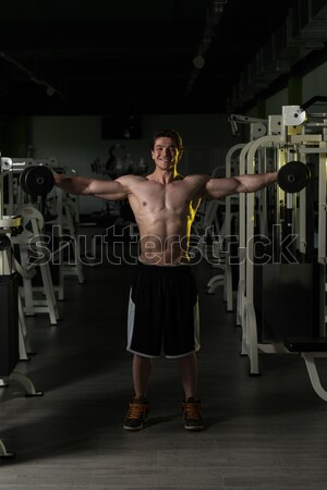 Mature Bodybuilder Exercising Biceps With Barbell Stock photo © Jasminko