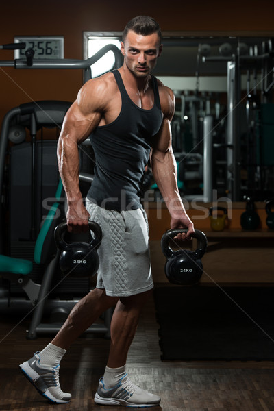 Homme bouilloire cloche musculaire exercice modèle Photo stock © Jasminko