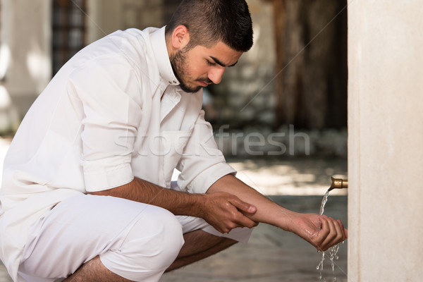 Islamic Religious Rite Ceremony Of Ablution Hand Washing Stock photo © Jasminko