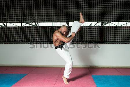 Mature Man Makes A Kick In Kimono Stock photo © Jasminko