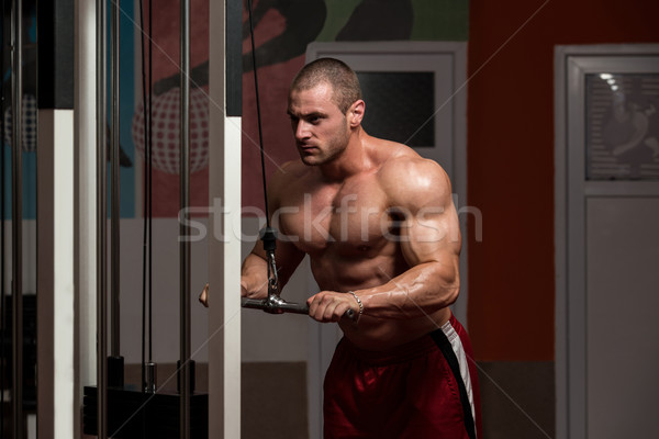 Muscular Man Doing Heavy Weight Exercise For Triceps Stock photo © Jasminko