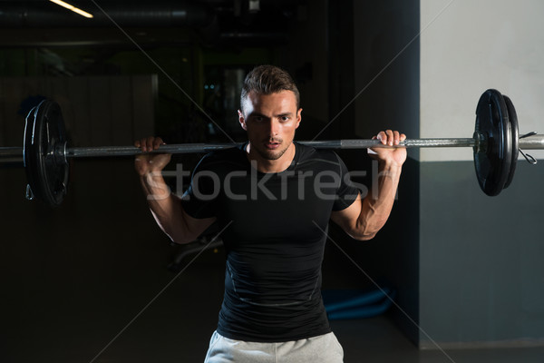 Young Man In Black T-Shirt Doing Barbell Squat Stock photo © Jasminko