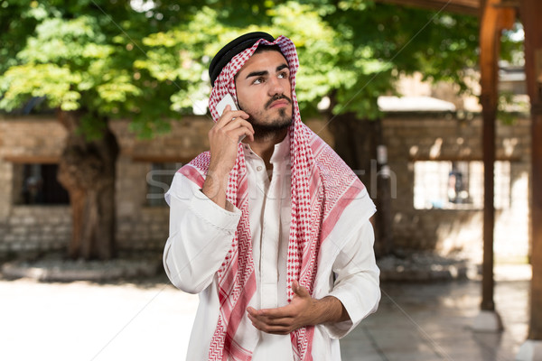 Arab Saudi Emirates Man Using A Smart Phone  Stock photo © Jasminko