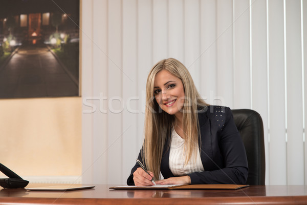 Businesswoman Working With Documents In The Office Stock photo © Jasminko