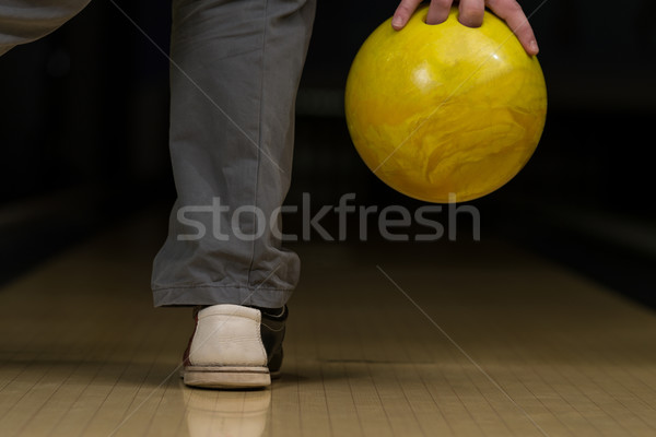 Stock photo: Bowler Attempts To Take Out Remaining Pins
