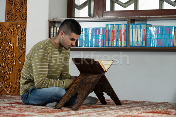 Stock photo: Arabic Muslim Man Reading Holy Islamic Book Koran