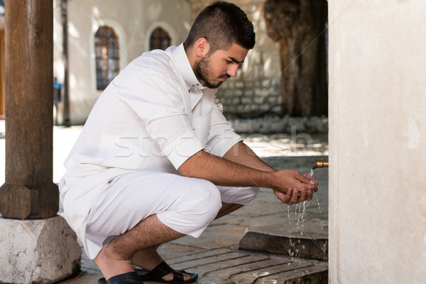 Stock photo: Islamic Religious Rite Ceremony Of Ablution Hand Washing