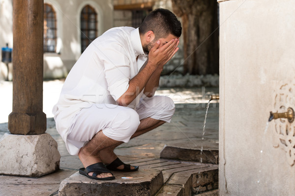 Islamic Religious Rite Ceremony Of Ablution Face Washing Stock photo © Jasminko