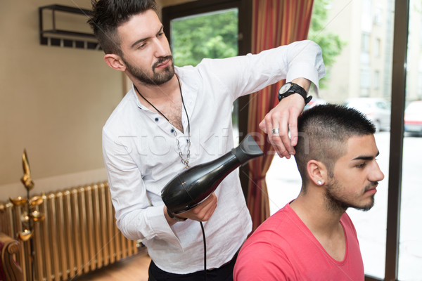 Hairdresser Blow Dry Man's Hair In Shop Stock photo © Jasminko