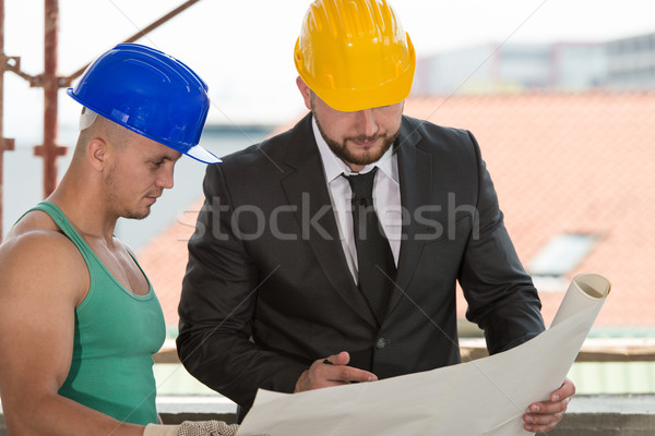 Engineer And Construction Worker Discussing A Project Stock photo © Jasminko