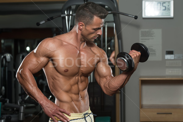 Young Man Working Out In A Health Club Stock photo © Jasminko
