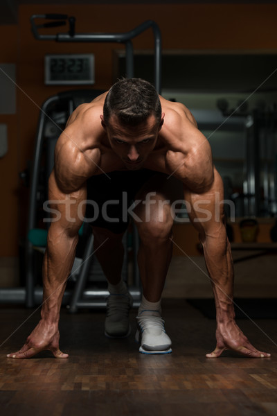 Strong Muscular Men Kneeling On The Floor Stock photo © Jasminko