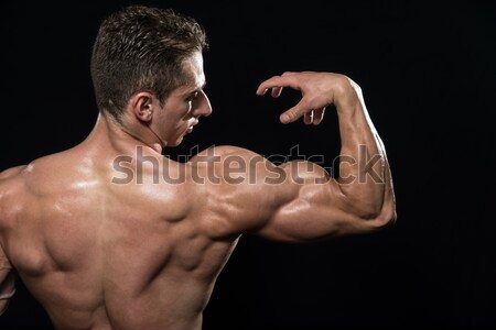 Bodybuilder tonen biceps jonge spieren Stockfoto © Jasminko