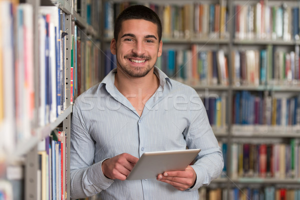 Estudante biblioteca bonito masculino laptop Foto stock © Jasminko