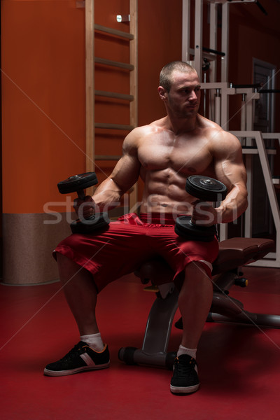 Young Man Working Out Biceps Stock photo © Jasminko
