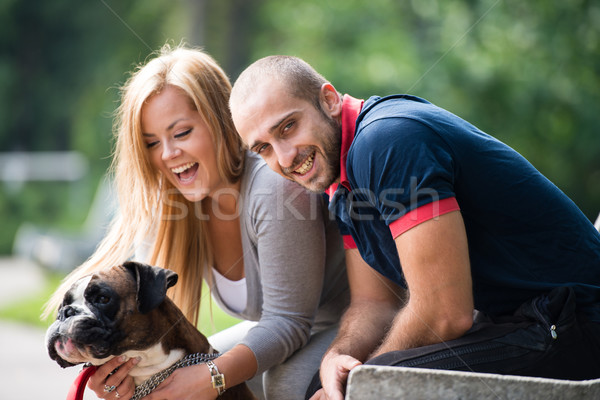 Happy Couple With German Boxer Stock photo © Jasminko